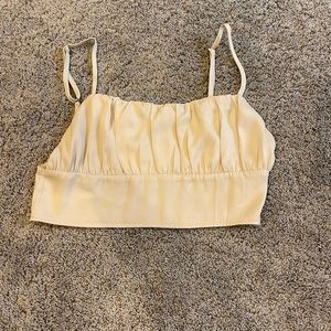 Pacsun’s “Kendall and Kylie” collection nude cropped silk top. Size S. NEW.